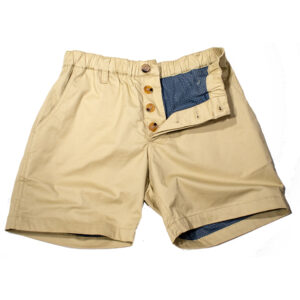 WOOF Commando Safe Chino Men's Short Shorts, 6 inch Inseam, Mesh-Lined "Solid Pines" with button-up waist, featuring a unique blue patchwork inner lining visible at the waist and leg openings, ideal for bulge enhancement. The shorts are laid flat on a white background.