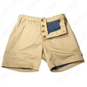 Khaki shorts with bulge enhancement and a unique blue denim pocket detail on the right side, displayed on a white background.
